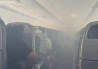CA403機(jī)艙冒濃煙致9人輕傷 艙口打開了應(yīng)急滑梯疏散乘客們